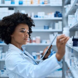 pharmacist browsing shelves
